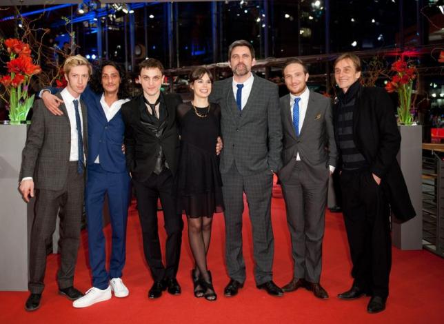 Director Sebastian Schipper (3rd R) and cast members, Max Mauff (L-R), Burak Yigit, Franz Rogowski, Laia Costa, Frederick Lau and Andre Hennicke, arrive on the red carpet for the screening of the in competition movie "Victoria" at the 65th Berlinale International Film Festival in Berlin February 7, 2015. REUTERS/Stefanie Loos